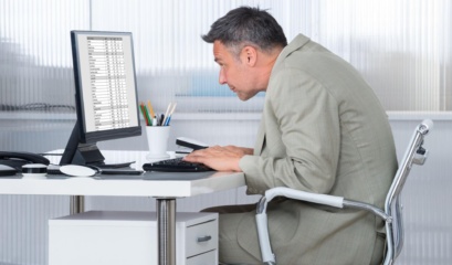 Man Sitting In Office Chair Demonstrating Forward Head Posture