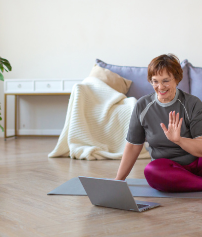 lady engaging in online physiotherapy on laptop