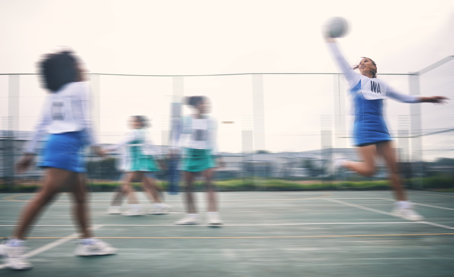 Sports,,netball,and,fitness,jump,by,women,at,outdoor,court