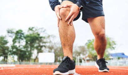 Man Holding His Medial Collateral Ligament In Pain