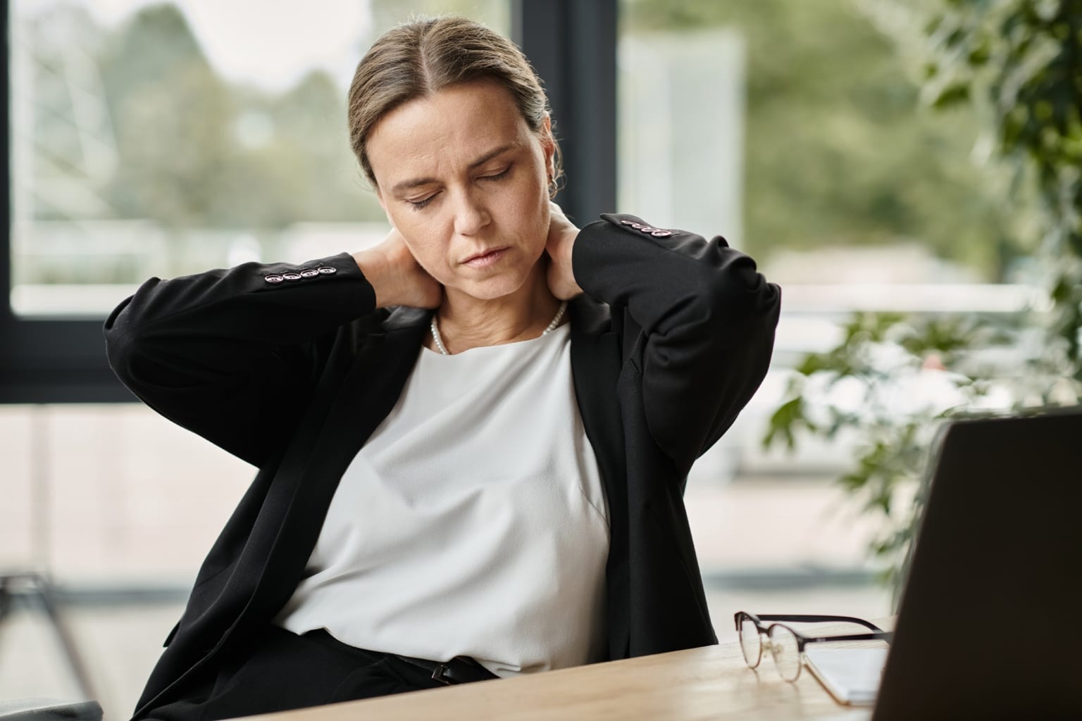 Middle Aged,woman,with,neck,pain,,stressed,,sitting,in,front,of