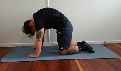 Man Doing The Cat Cow Exercise